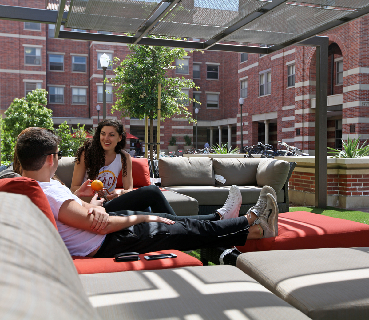 Students lounging near residence hall